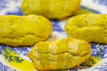 Traditional Portuguese cod dumplings served with olive oil