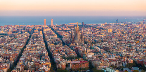 Aerial view of Barcelona City Skyline and Sagrada Familia Cathedral at sunset. Residential famous...
