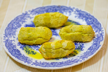 Traditional Portuguese cod dumplings served with olive oil