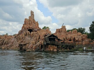 Magic Kingdom Park Big Thunder Mountain Railroad Water Cloud Sky Lake