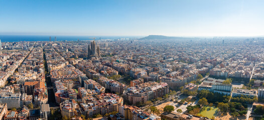 Aerial view of Barcelona City Skyline and Sagrada Familia Cathedral at sunset. Residential famous...