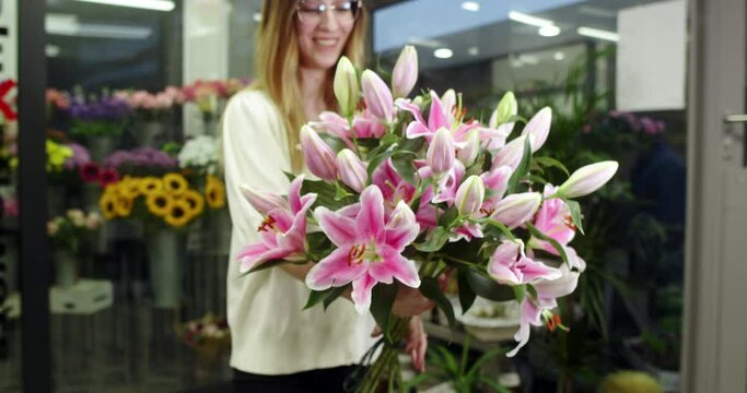 the florist is showing some lilies that have bloomed