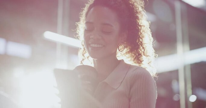 Coffee break, text and happy business. woman in a warehouse with social media, chat or gif. Tea, smartphone and female factory manager online with web communication, conversation or checking email