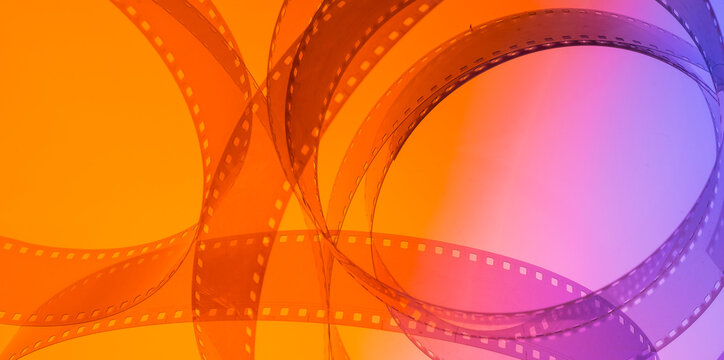 abstract multicolored background with film strip.film festival film production premiere announcement concept