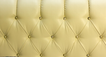 the back of a luxury sofa in retro style with buttons and rhombuses