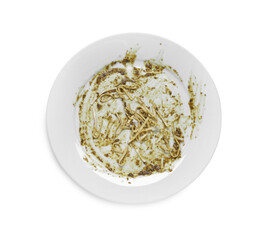 Dirty plate with smeared sauce and pasta on white background, top view