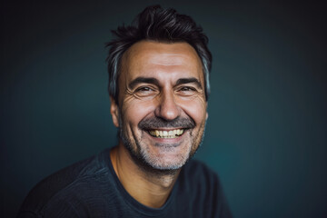 Fototapeta premium A man with gray hair and a beard smiles for the camera