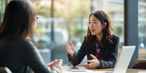 Asian HR manager conducting an engaging and productive job interview 