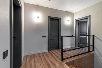A black interior door ajar in a private house