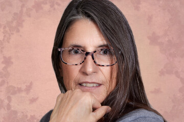 Close up of a senior aged woman smiling wearing eyeglasses