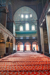 Sunlight streams through the trellised and arched windows of the magnificient Blue mosque, a...