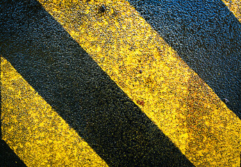 A zebra crossing with a color on a black and yellow background.