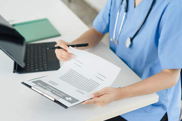 Healthcare Professional Reviewing Medical Documents.