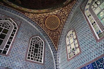 Artistic ceramic tiles in intricate ottoman patterns lining the private chambers and walls of the...
