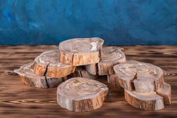 Cross sections of apple tree trunk as a pedestal for bottles, jars, flacons for medicine, spa, cosmetics.