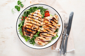 Roasted chicken breast, fillet and fresh vegetable salad.
