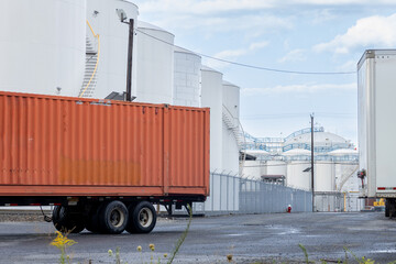 Semi Truck with Red Cargo Container at Industrial Port