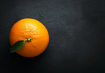 Vibrant Orange with Leaf on a Matte Black Background