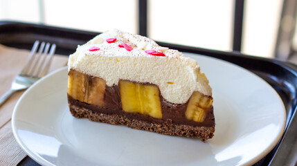 Chocolate Banoffee Pie on white plate.