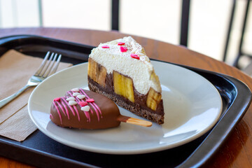 Chocolate Banoffee Pie on white plate.