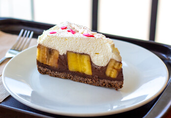 Chocolate Banoffee Pie on white plate.