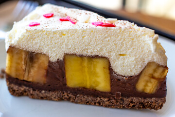 Chocolate Banoffee Pie on white plate.