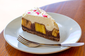 Chocolate Banoffee Pie on white plate.