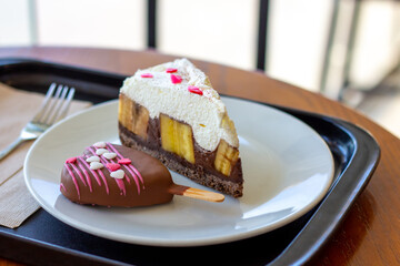 Chocolate Banoffee Pie on white plate.