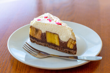 Chocolate Banoffee Pie on white plate.