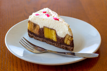 Chocolate Banoffee Pie on white plate.