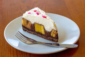 Chocolate Banoffee Pie on white plate.