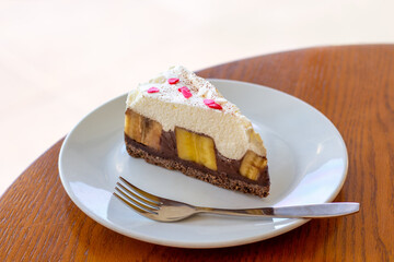 Chocolate Banoffee Pie on white plate.