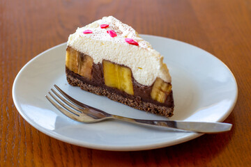 Chocolate Banoffee Pie on white plate.