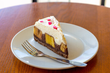 Chocolate Banoffee Pie on white plate.