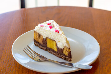 Chocolate Banoffee Pie on white plate.