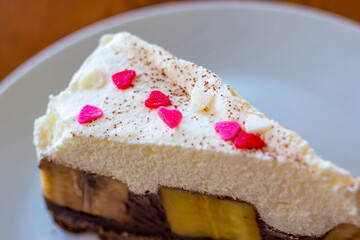 Chocolate Banoffee Pie on white plate.