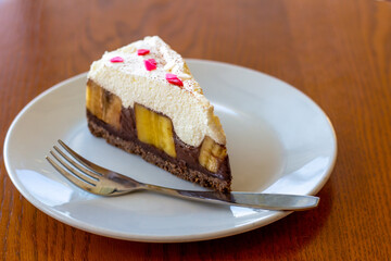 Chocolate Banoffee Pie on white plate.