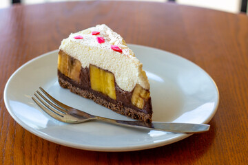 Chocolate Banoffee Pie on white plate.