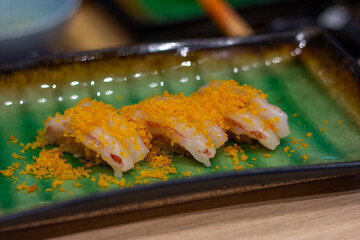Ama Ebi Sushi on a Japanese style plate with copy space