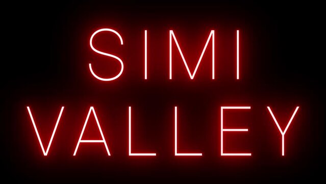 Flickering red retro style neon sign glowing against a black background for SIMI VALLEY