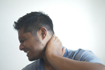 man suffering chronic neck pain 