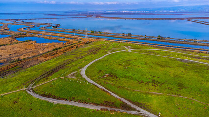 Aerial view of Sunnyvale Bay Trail on top of former landfill. Scenic view of San Francisco Bay with...