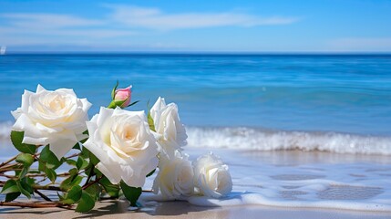 A serene beach scene with a blue sky, white roses, and a calm sea 