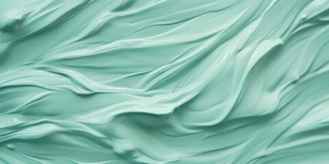Close-up view of a soothing and creamy aqua-colored substance, perfect for abstract or beauty backgrounds.