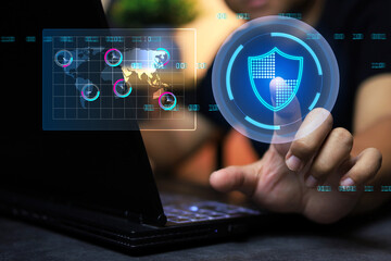 Man using laptop computer and touch on shield to activate antivirus system and canning servers station around the world for cybercrime and data breach protection
