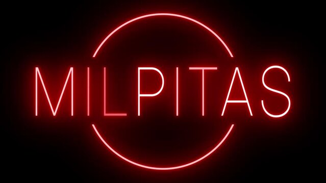 Flickering red retro style neon sign glowing against a black background for MILPITAS