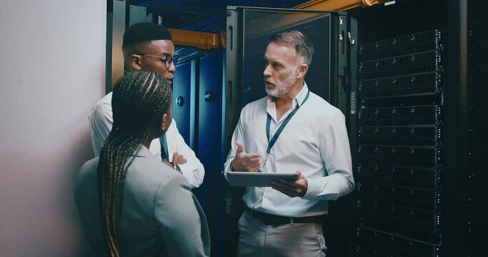 Technician, manager and tablet in server room for programming, engineering and cloud computing solution. Senior boss, people and group in data center with digital technology for system gdpr training
