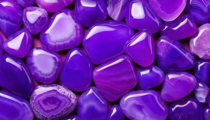 Obraz na płótnie Canvas Pile of smooth polished purple agate stones background 