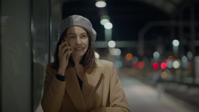 Stressed Woman Talking Worried on Smartphone in the City at Night