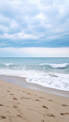 Fototapeta na wymiar Sandy beach in nasty weather with big waves, stormy sea landscape with copyspace